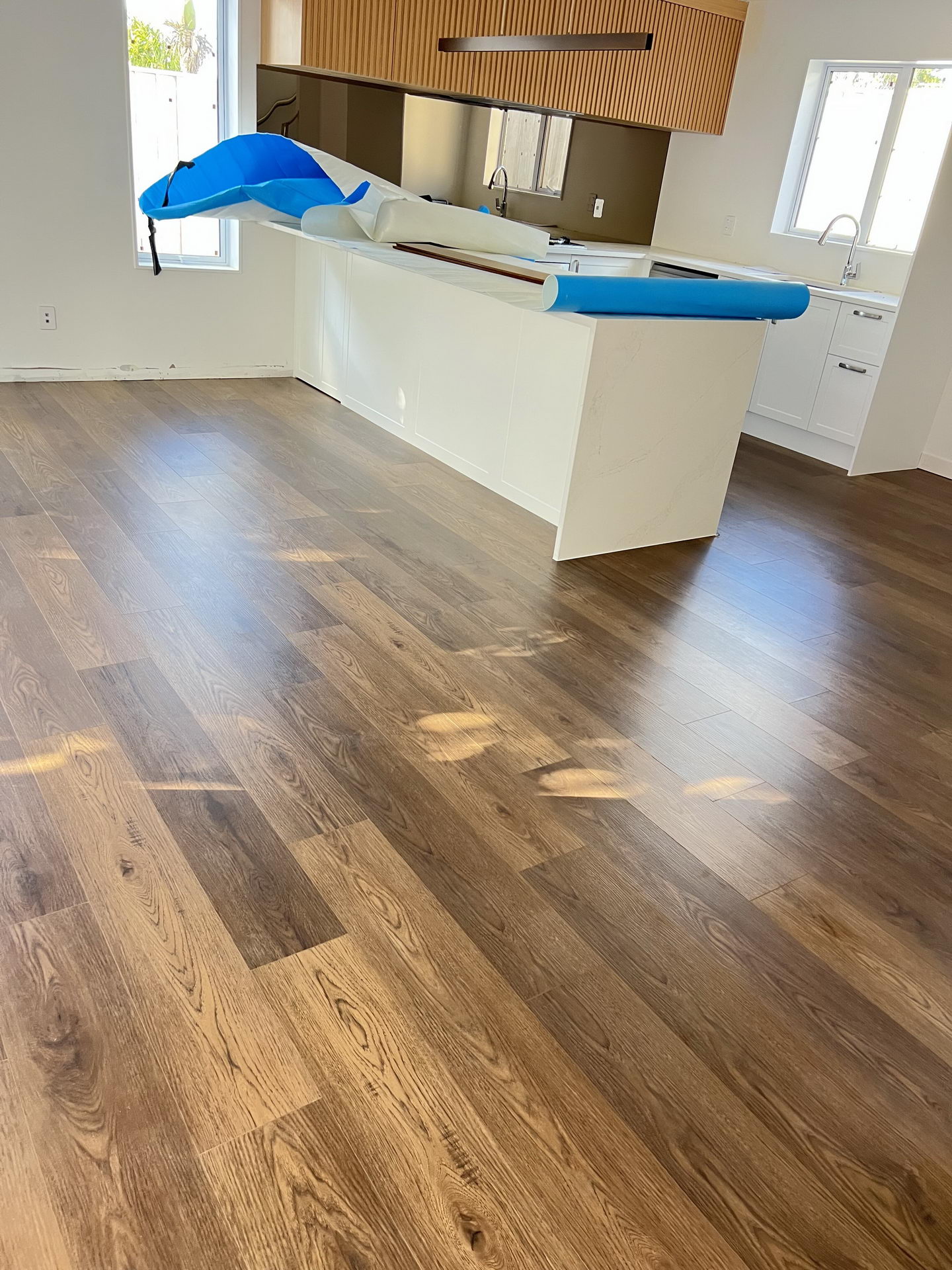93d2f276d23de3c9812bcd2dfd068f5 93d2f276d23de3c9812bcd2dfd068f5 rotated Bring a touch of classic sophistication to your home with <strong>English Walnut Oak</strong>. Its rich walnut tones and detailed grain pattern exude elegance, making it a standout option for both traditional and contemporary designs. Designed with <strong>water-resistant flooring</strong> technology, it provides excellent protection against spills and moisture. Perfect for creating warm and inviting spaces, English Walnut Oak is a durable and stylish choice for <strong>laminate wood flooring</strong> enthusiasts.