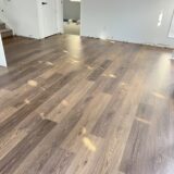 b1d0ca3638b262ec6750ea75ed8edb1 rotated Bring a touch of classic sophistication to your home with <strong>English Walnut Oak</strong>. Its rich walnut tones and detailed grain pattern exude elegance, making it a standout option for both traditional and contemporary designs. Designed with <strong>water-resistant flooring</strong> technology, it provides excellent protection against spills and moisture. Perfect for creating warm and inviting spaces, English Walnut Oak is a durable and stylish choice for <strong>laminate wood flooring</strong> enthusiasts.
