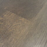 oak espresso02 scaled Elevate your interiors with the dramatic elegance of <strong>Oak Espresso</strong>, a dark-toned engineered <strong>wood flooring</strong> option designed for modern sophistication. Its rich coffee hues and textured grain make a bold statement in any room, enhancing both contemporary and classic styles. Engineered for lasting durability and minimal expansion, Oak Espresso is perfect for high-traffic areas requiring both functionality and style. Its low-maintenance design ensures ease of care, making it a practical yet luxurious flooring solution.