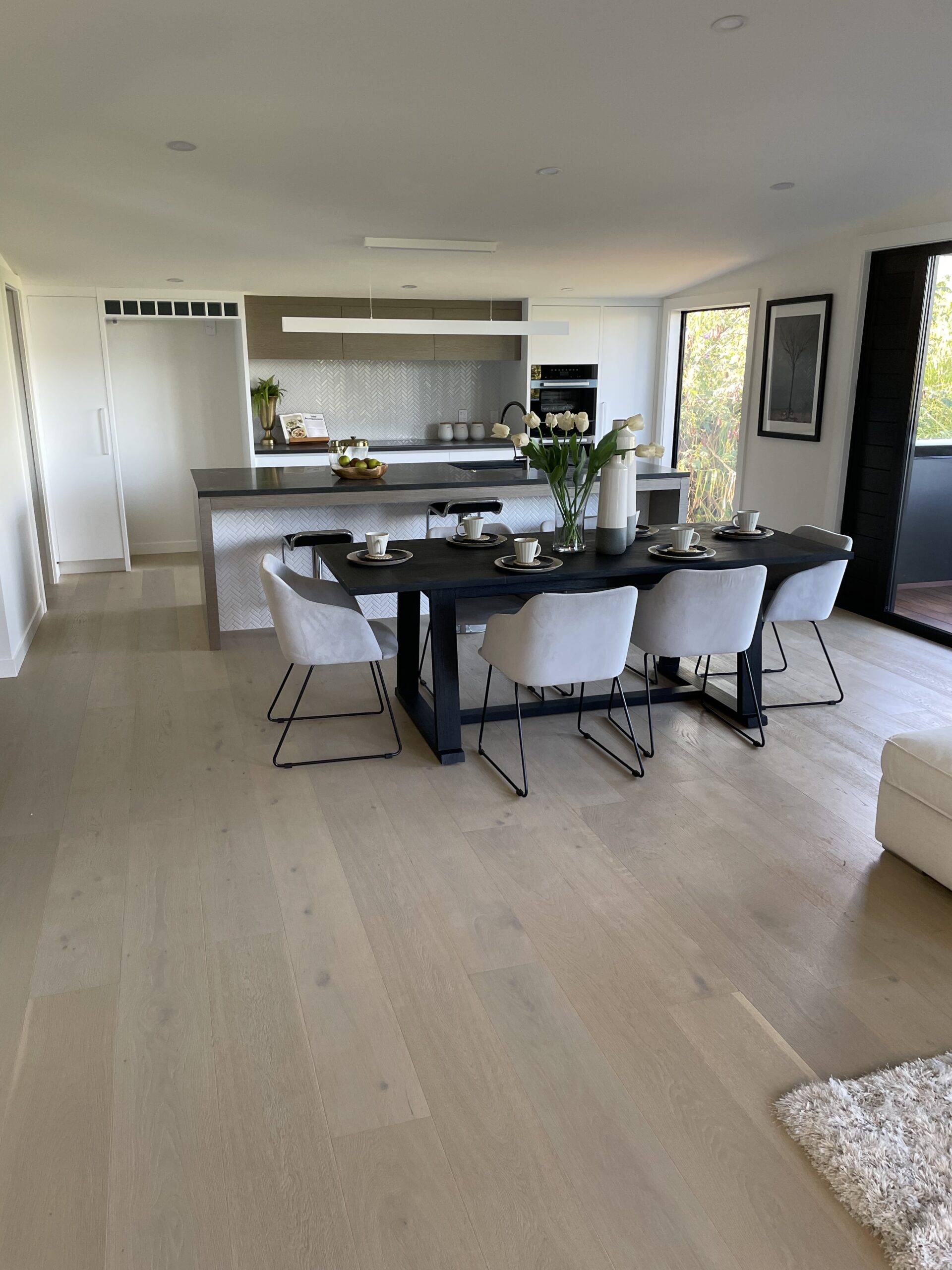 oak-vintage-white04 oak vintage white04 scaled <strong>Oak Vintage White Engineered Hardwood Flooring</strong> Refresh your living space with Oak Vintage White, an engineered hardwood flooring that provides a clean, minimalist look. Its pristine white finish offers a modern twist on traditional wood floors, making it a standout choice for contemporary homes. Oak Vintage White is built to last, offering stability and resistance to daily wear and tear. It's perfect for anyone seeking a stylish, yet practical flooring solution that keeps up with the pace of everyday life.