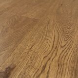 oak yellowstone02 scaled <strong>Oak Yellowstone Engineered Hardwood Flooring</strong> Bring the rustic charm of nature indoors with Oak Yellowstone, an engineered hardwood flooring that mirrors the raw beauty of the great outdoors. Its natural, earthy tones provide a sturdy and inviting atmosphere, suitable for any room. Engineered to resist heavy foot traffic, Oak Yellowstone is an excellent choice for both residential and commercial spaces. Its authentic wood finish and strong construction make it a practical yet beautiful flooring solution.